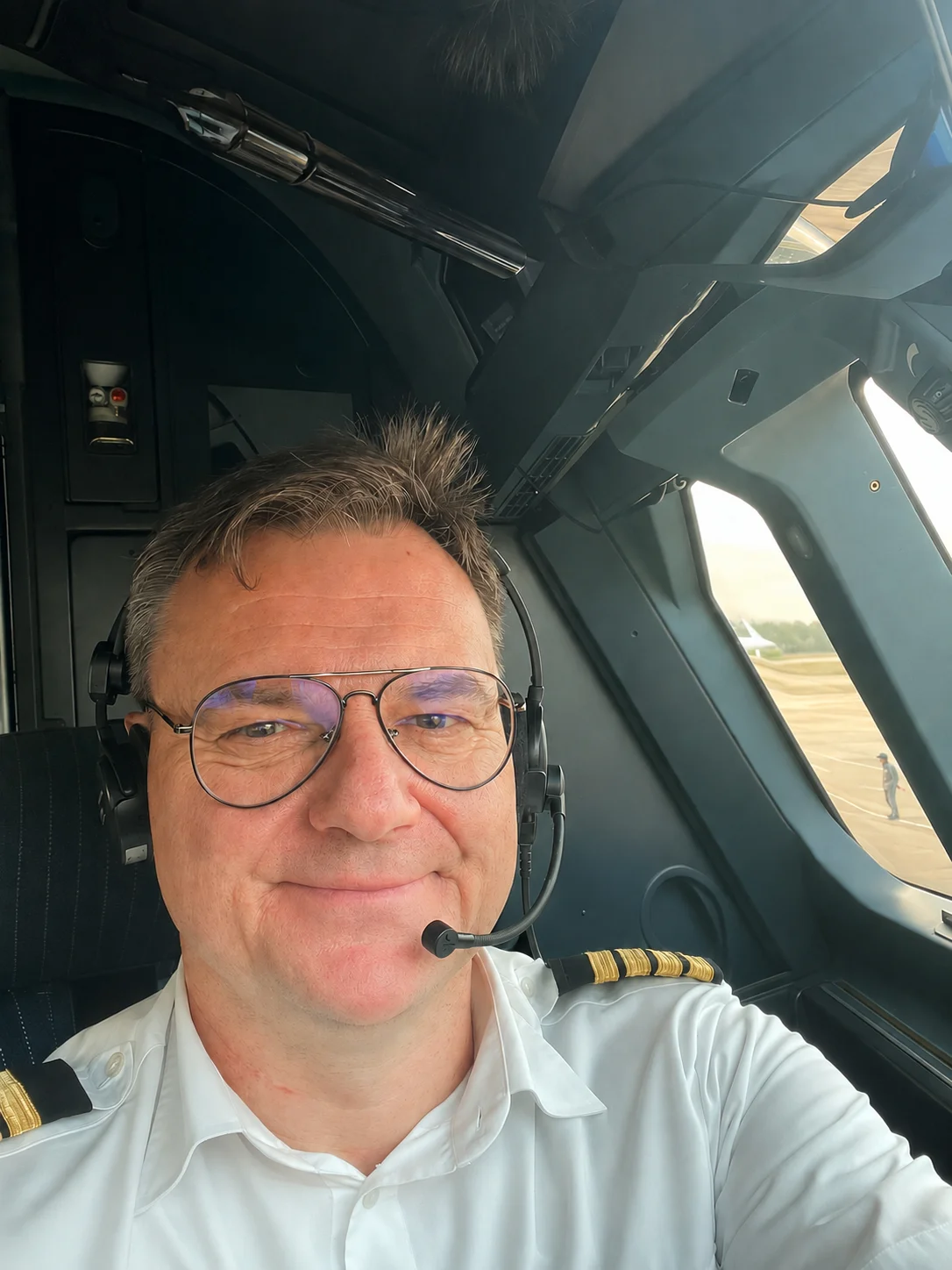 Captain Maciej Peikert in the cockpit